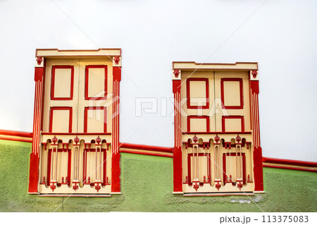 Beautiful facade of the houses at the historical downtown of the heritage town of Salamina located at the Caldas department in Colombia. 113375083