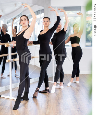 Girls in ballet class perform Batman with participation of mature female mentor 113377625