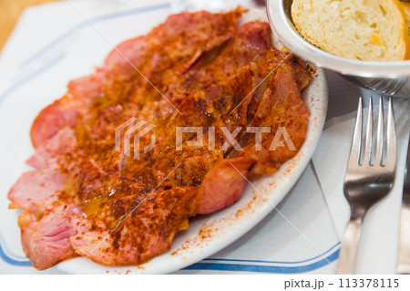 Tasty slices of lacon galician boiled pig ham served at plate 113378115