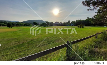 Sun at sunset in village field Sun at sunset in village field 113380691