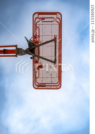 directly underneath a caged aerial work platform lift. directly underneath a caged aerial work platform lift. 113380925