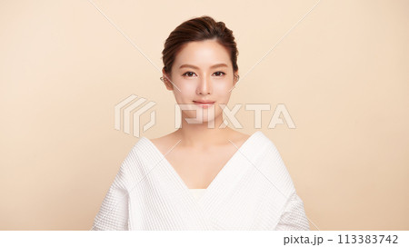 Beautiful young asian woman with clean fresh skin on beige background, Face care, Facial treatment, Cosmetology, beauty and spa, Asian women portrait. 113383742