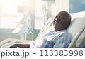 Male patient, elderly dark-skinned African American woman, in a modern, light-colored medical ward of a hospital with modern equipment, new technologies. 113383998