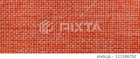 Texture of dark orange background from woven textile material with wicker pattern, macro. Vintage red fabric Texture of dark orange background from woven textile material with wicker pattern, macro. Vintage red fabric 113386782