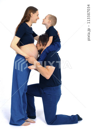 Beautiful pregnant woman with her family on white background 113387034