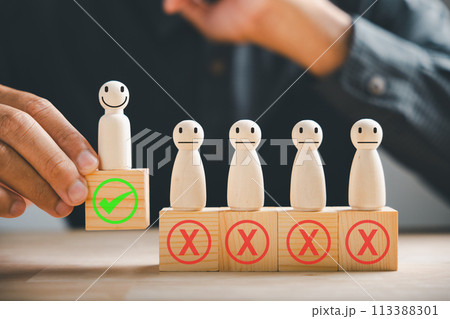 Hand of a businessman touches wooden cube with a check mark symbolizing employment choice. Illustrates business service rating and satisfaction concept. Think With Yes Or No Choice. Hand of a businessman touches wooden cube with a check mark symbolizing employment choice. Illustrates business service rating and satisfaction concept. Think With Yes Or No Choice. 113388301