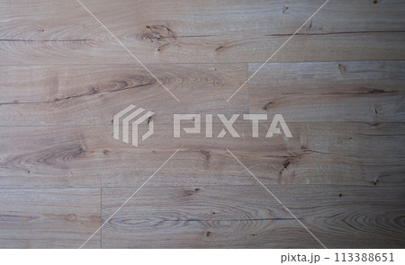 Natural durable beige brown wood laminate closeup Natural durable beige brown wood laminate closeup 113388651
