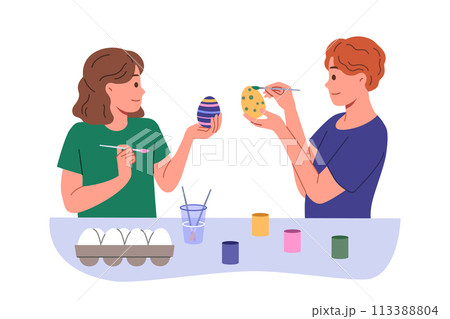 Children paint easter eggs in preparation for main christian holiday, standing at table with gouache 113388804