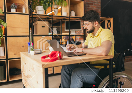man sitting on wheelchair 113390209