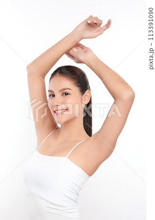 Beautiful Young Asian woman lifting hands up to show off clean and hygienic armpits or underarms on white background, Smooth armpit cleanliness and protection concept Beautiful Young Asian woman lifting hands up to show off clean and hygienic armpits or underarms on white background, Smooth armpit cleanliness and protection concept 113391090