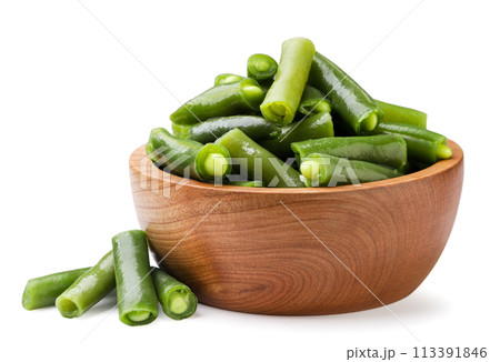 Green beans in a wooden plate and a bunch on a white background. Isolated 113391846
