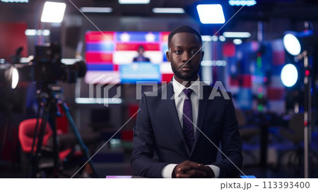 Serious News Anchor Ready for Evening Broadcast Serious News Anchor Ready for Evening Broadcast 113393400