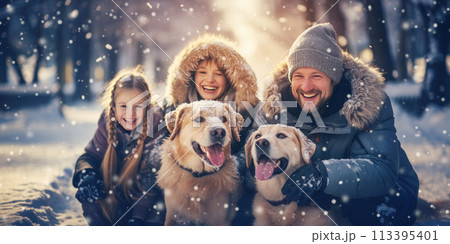 Family with dogs in the natural park in winter. 113395401