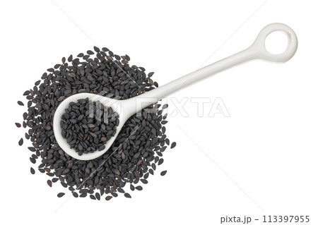black sesame seeds in ceramic spoon isolated on white background. Top view. Flat lay 113397955