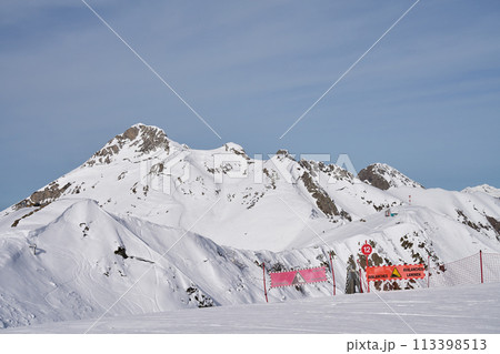 Alpine Ski Slope and Warning Signs 113398513