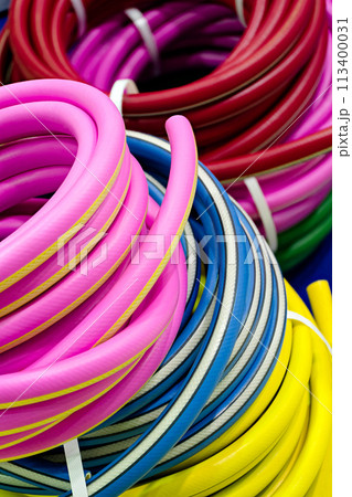 Rolled up colorful garden hose Rolled up colorful garden hose 113400031