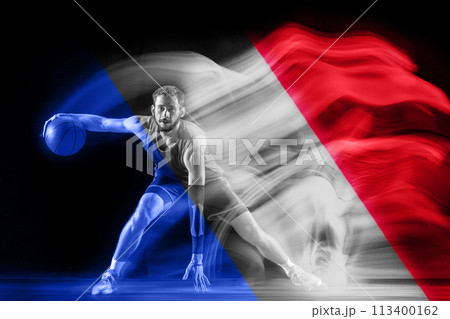 Muscular young man, basketball player in motion, dribbling ball, playing on black background with flag of France element 113400162
