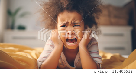 Little angry girl shouting in her room. Concept of emotions and family relation. 113400512