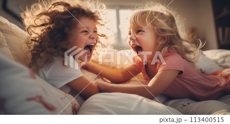 Siblings having fight with pillows at home. Concept of conflict and family relation. 113400515