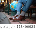 Businessman's feet with a globe in the park, the concept of business connections around the world 113400923