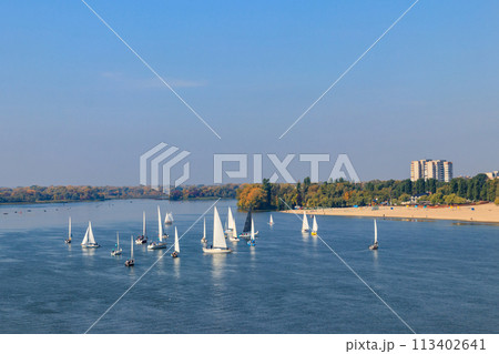 Yachts at sailing regatta on the Dnieper river in Kremenchug, Ukraine Yachts at sailing regatta on the Dnieper river in Kremenchug, Ukraine 113402641