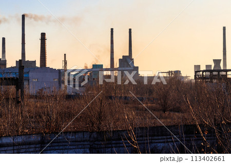 View of old factory with pipes with smoke. Air pollution, environmental damage 113402661
