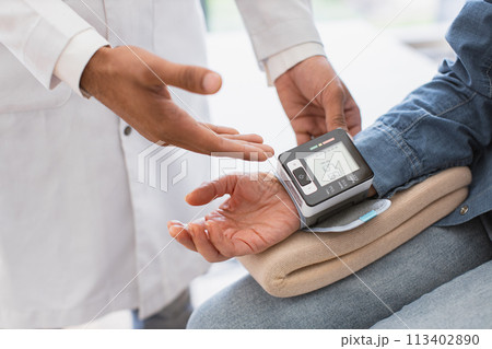 Crop of doctor and patient having talk about diagnosis and medical checkup. 113402890