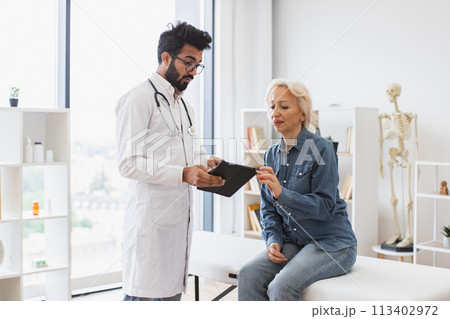 Young specialist writing instruction for taking medication correctly. Young specialist writing instruction for taking medication correctly. 113402972