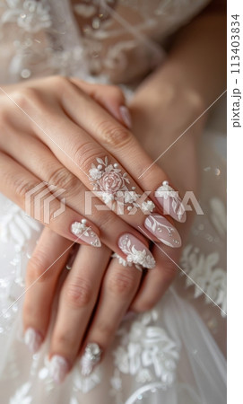 Wedding nail design of the bride, beautiful hands of the bride with well-groomed manicure 113403834