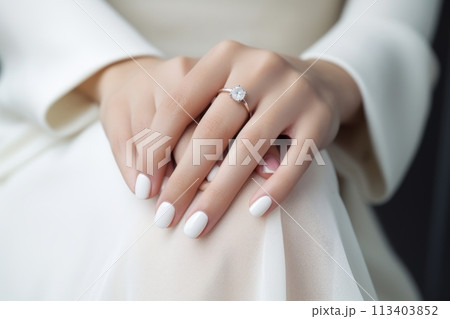 Wedding nail design of the bride, beautiful hands of the bride with well-groomed manicure 113403852