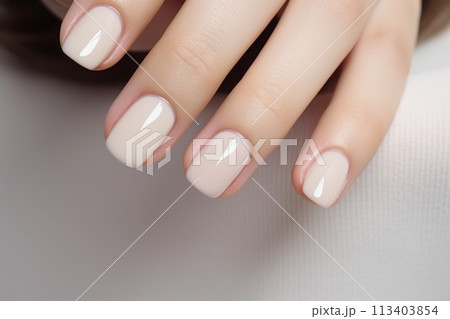 Calm beauty delicate nail design for a girl, beautiful female hands with a well-groomed neutral manicure 113403854