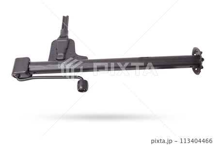 Black metal jack for replacing a car wheel on a white isolated background in a car service. Equipment in the trunk and in the garage. Black metal jack for replacing a car wheel on a white isolated background in a car service. Equipment in the trunk and in the garage. 113404466