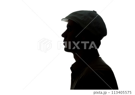 Portrait of a young man in cap, side view 113405575
