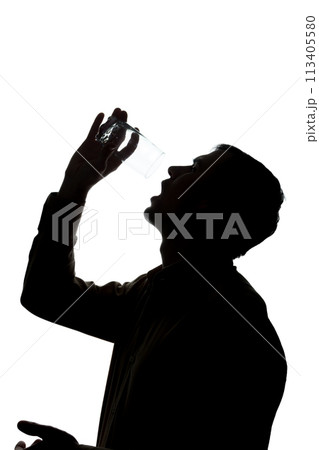Young man drinks soda water, no water - silhouette Young man drinks soda water, no water - silhouette 113405580