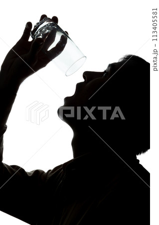Young man drinks soda water, no water - silhouette Young man drinks soda water, no water - silhouette 113405581