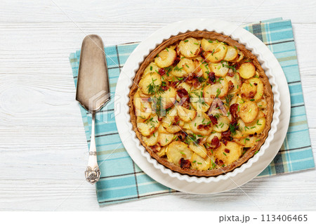 Irish potato pie with bacon in baking dish 113406465