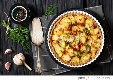 Irish potato pie with bacon in baking dish 113406469