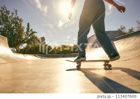 Close up of young man doing tricks on his skateboard at the skate park. Active sport concept 113407600