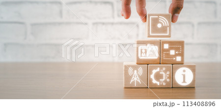 RFID, Radio Frequency Identification concept, Hand holding wooden block on desk with Radio Frequency Identification icon on virtual screen. RFID, Radio Frequency Identification concept, Hand holding wooden block on desk with Radio Frequency Identification icon on virtual screen. 113408896