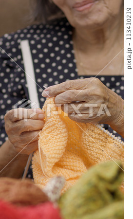 Elderly woman knitting for protect dementia and memory loss. Elderly woman knitting for protect dementia and memory loss. 113410219