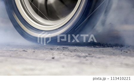 EV Drag racing car is burning tires at start line. 113410221