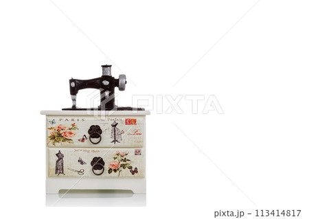 jewelry box with decorative sewing machine on a white background 113414817