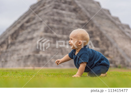 Baby traveler, tourists observing the old pyramid and temple of the castle of the Mayan architecture known as Chichen Itza these are the ruins of this ancient pre-columbian civilization and part of 113415477