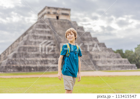 Boy traveler, tourists observing the old pyramid and temple of the castle of the Mayan architecture known as Chichen Itza these are the ruins of this ancient pre-columbian civilization and part of 113415547