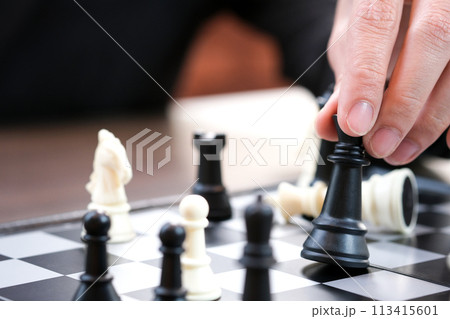 The hands of the people on the competition and the strategic planning guidelines on the checkmate board. Succeed 113415601