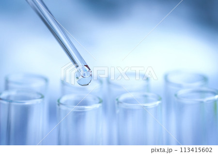 The researchers tested antibiotics in a glass tube in a hospital lab. The researchers tested antibiotics in a glass tube in a hospital lab. 113415602