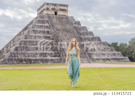 Beautiful tourist woman observing the old pyramid and temple of the castle of the Mayan architecture known as Chichen Itza these are the ruins of this ancient pre-columbian civilization and part of 113415725