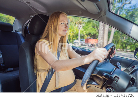 Pregnant woman driving with safety belt on in the car. Confident and capable, a pregnant woman takes the wheel, driving with care and determination as she navigates the journey of motherhood 113415726