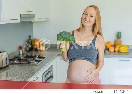 Embracing a nutrient-rich choice, a pregnant woman eagerly prepares to enjoy a wholesome serving of broccoli, prioritizing healthy and nourishing options during her pregnancy Embracing a nutrient-rich choice, a pregnant woman eagerly prepares to enjoy a wholesome serving of broccoli, prioritizing healthy and nourishing options during her pregnancy 113415864