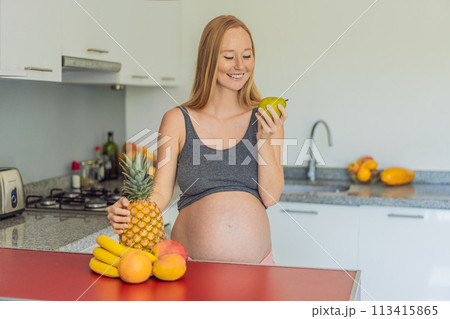 Embracing a healthy choice, a pregnant woman prepares to enjoy a nutritious moment, gearing up to eat fresh fruit and nourish herself during her pregnancy Embracing a healthy choice, a pregnant woman prepares to enjoy a nutritious moment, gearing up to eat fresh fruit and nourish herself during her pregnancy 113415865